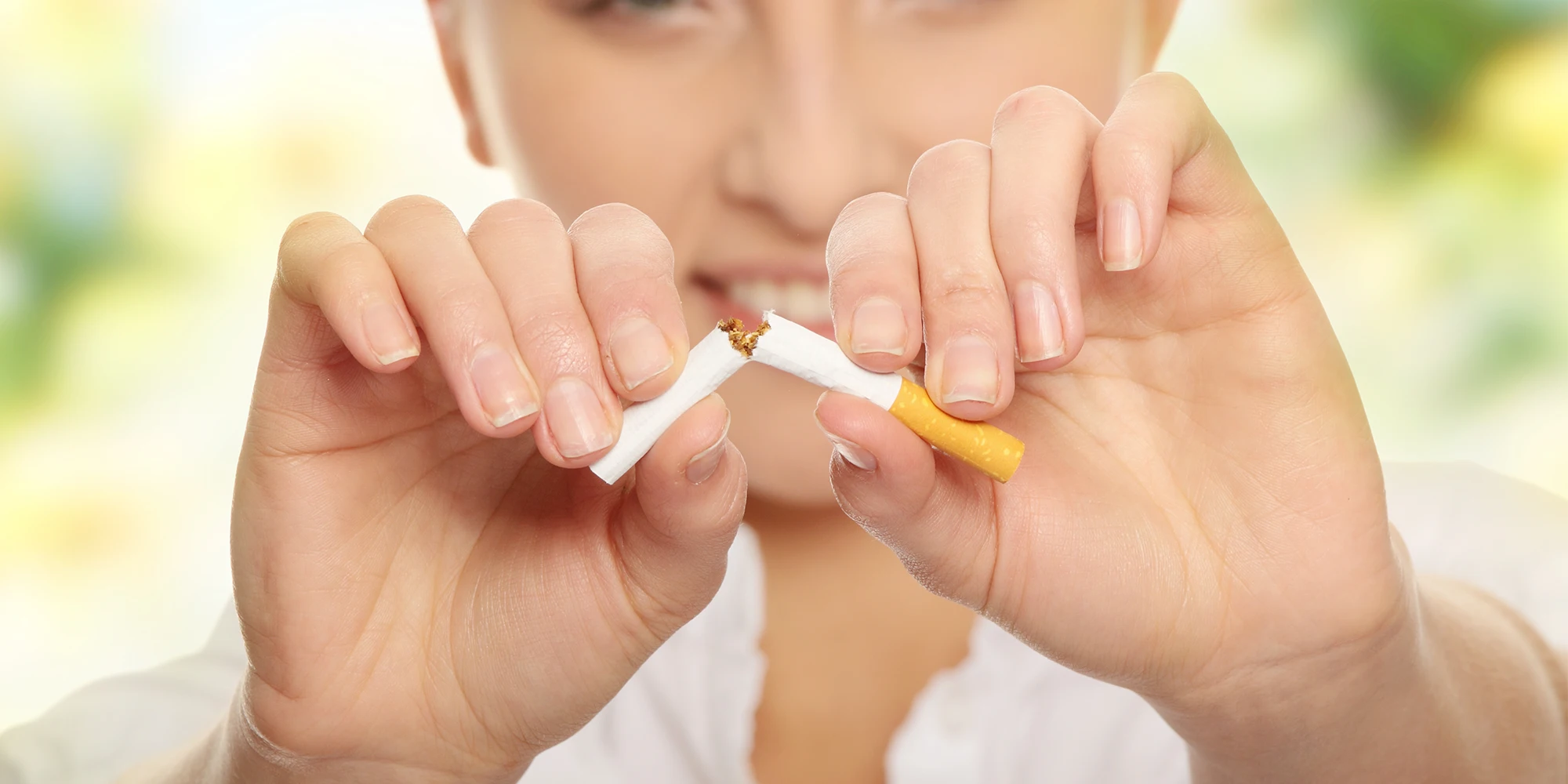 Stop Smoking Woman Breaking a Cigarette in Half